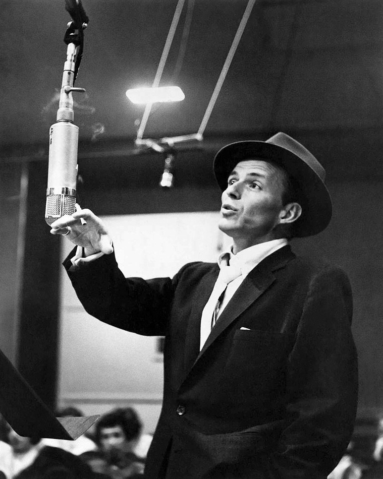 Frank Sinatra recording inside Capitol Studios, c. 1955 — Public Domain / Wikimedia Commons